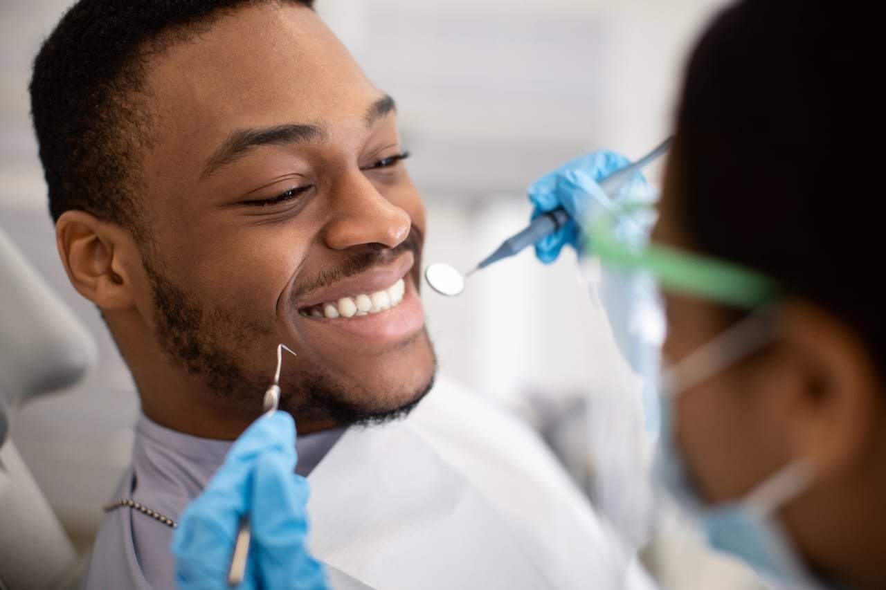 Smiling patient at a preventative dental visit in Orlando